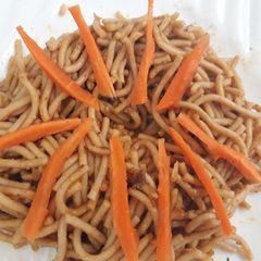 A picture of Spagetti and carrots.