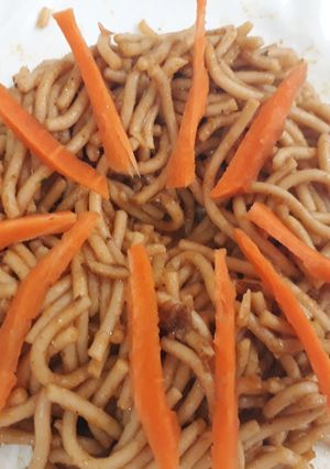 A picture of Spagetti and carrots.