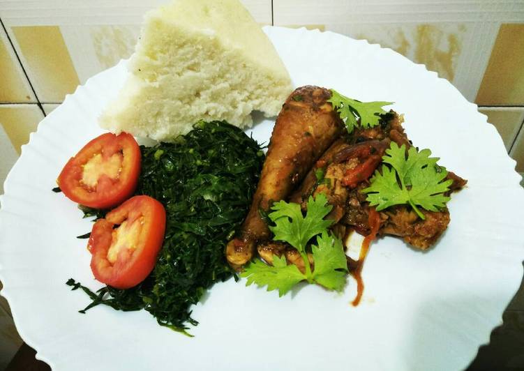 Wet fried chicken with greens and ugali