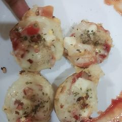 A picture of My innovatie dish appam pizza cups.