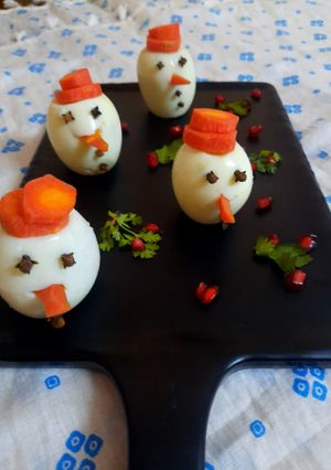 A picture of Boiled egg cut snowman.