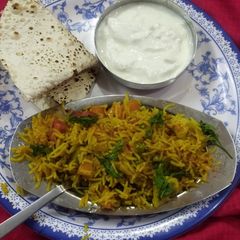 A picture of Vegetable pulao in pressure cooker.