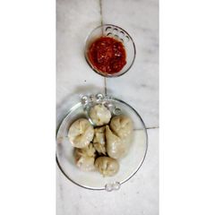 A picture of Vegetable momos with chutney (Snacks).