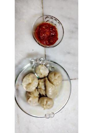 A picture of Vegetable momos with chutney (Snacks).