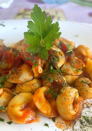 A picture of Meat-Filled Tortellini with Fresh Cherry Tomatoes.