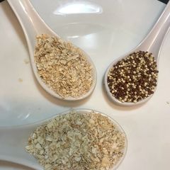 A picture of Oatmeal with quinoa, asparagus and fresh mushroom.