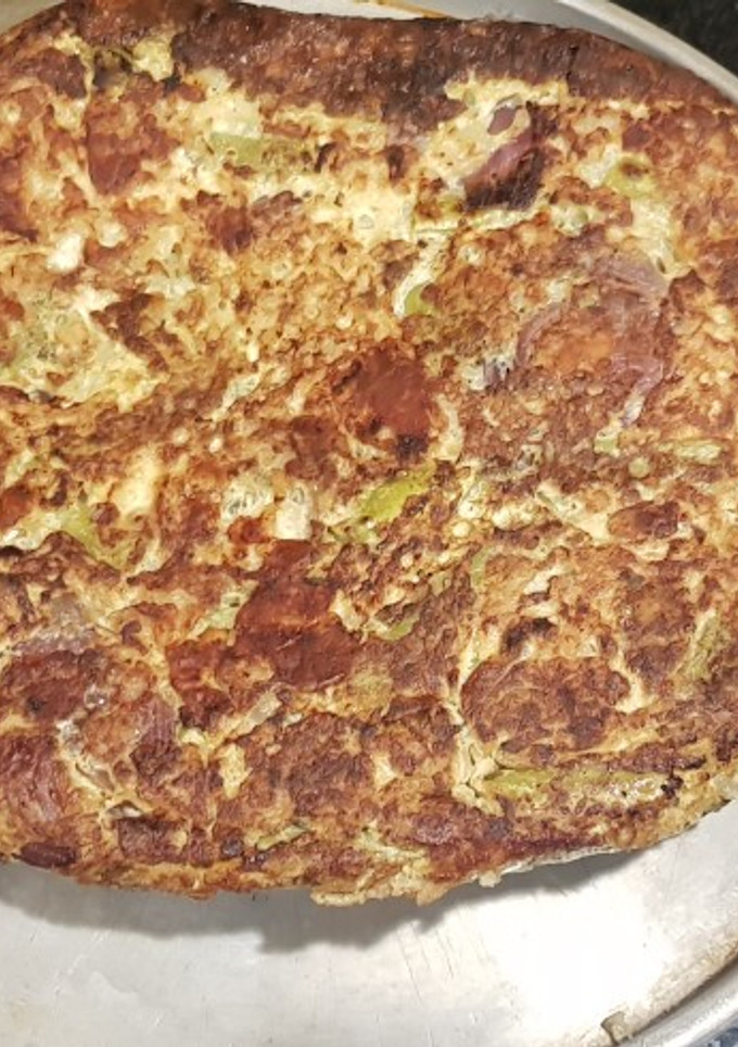 Una foto de Tortilla de porotos verdes y cebolla