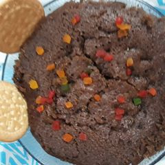 A picture of Egg less suji or maida ka chocolate cake in pressure cooker.