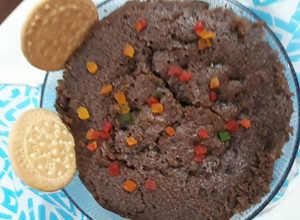 A picture of Egg less suji or maida ka chocolate cake in pressure cooker.