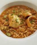 Arroz caldoso de rape, sepia, calamares y habas