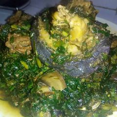 A picture of Vegetable soup with ugba and snail.