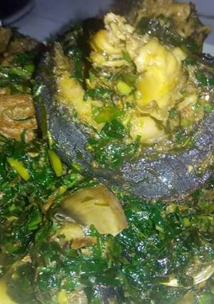 A picture of Vegetable soup with ugba and snail.
