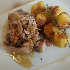 A picture of Stinco di maiale slow cooked pork hock.
