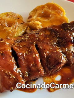 Una foto de Carré de cerdo al romero con mostaza y miel