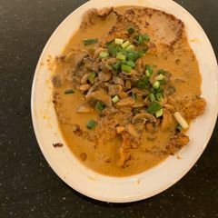 A picture of Veal with Mushroom Sauce.