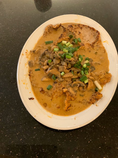 A picture of Veal with Mushroom Sauce.
