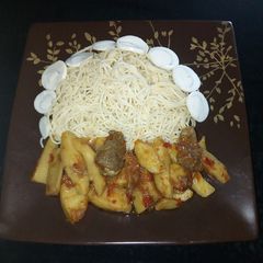 A picture of White spaghetti with Irish sauce.