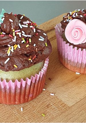 A picture of Almond Pistachio Cupcakes with Dark Chocolate Ganache.