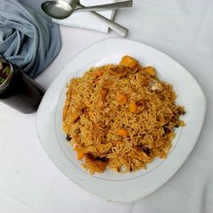 A picture of Jollof rice with smoked fish.