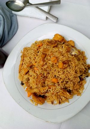 A picture of Jollof rice with smoked fish.