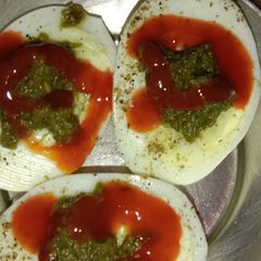 Boiled eggs with tomato sauce A picture of Boiled eggs with tomato sauce.