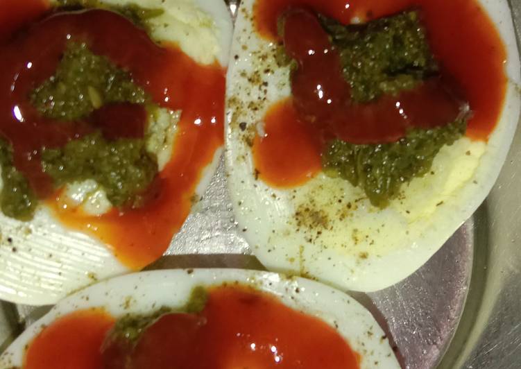 Boiled eggs with tomato sauce