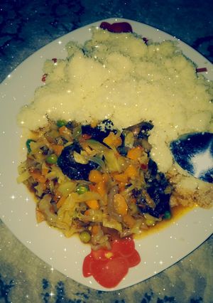 A picture of Couscous with vegetables sauce.