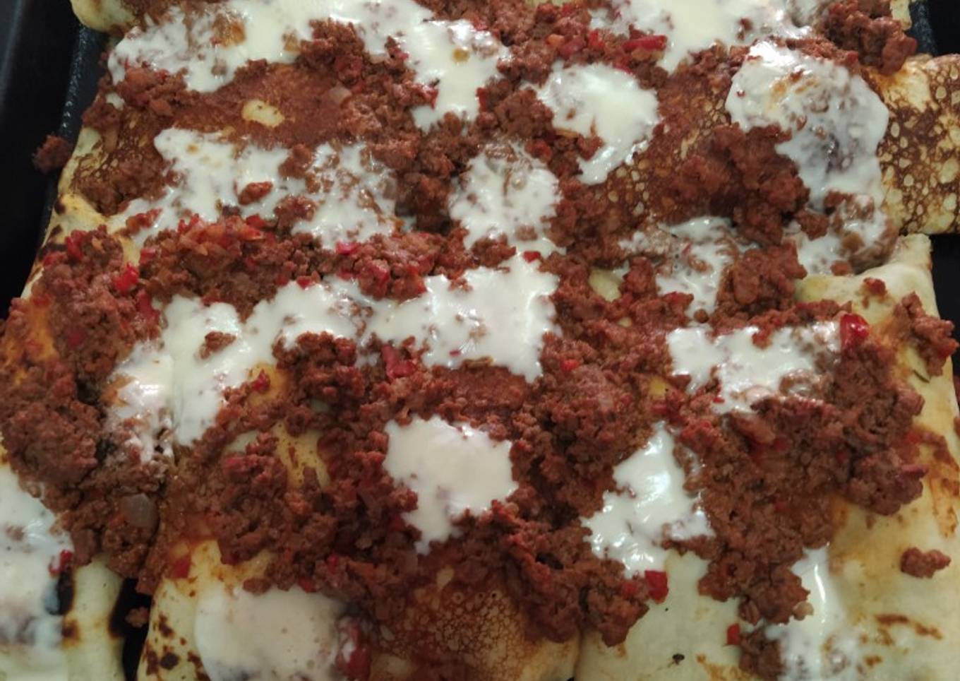 Canelones de acelga con salsa bolognesa