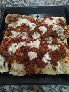 Una foto de Canelones de acelga con salsa bolognesa