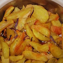 A picture of Baked Rosemary potatoe wedges and cheese #themechallenge.