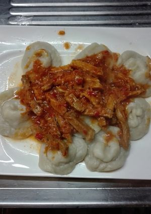 Una foto de (Sorrentinos charrúas) con salsa de zanahoria y cerdo