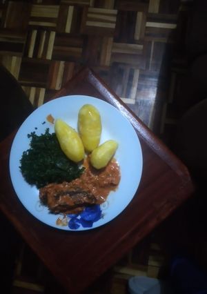 A picture of Fish fillet coconut served with deep fried potatoes.