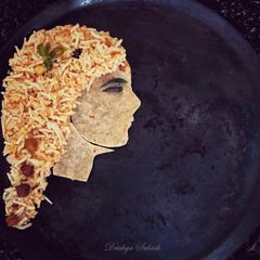 A picture of Tamarind rice [ Puliyogare ].