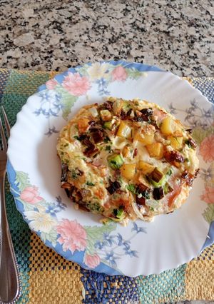 A picture of Oven-Baked Potato Omelette Stuffed with Ham and Cheese.