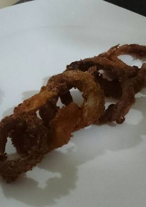 Una foto de Aros de cebolla condimentados