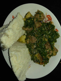 A picture of Ugali and beef with khale / spinach.
