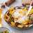 Huevos rotos con patatas y boletus edulis en conserva