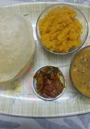 A picture of Halwa Pori Tarkari with Achar.