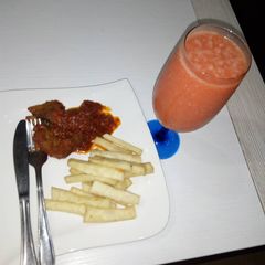 A picture of Fried yam and pepper goat meat + water melon smoothie.
