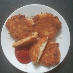 A picture of Cheddar Potato cakes breaded.