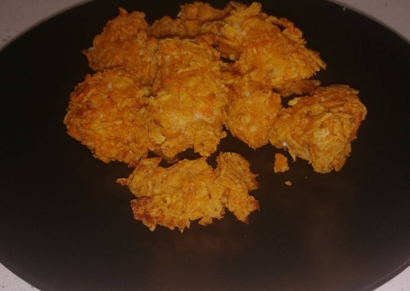 Pollo marinado rebozados con doritos (al horno)