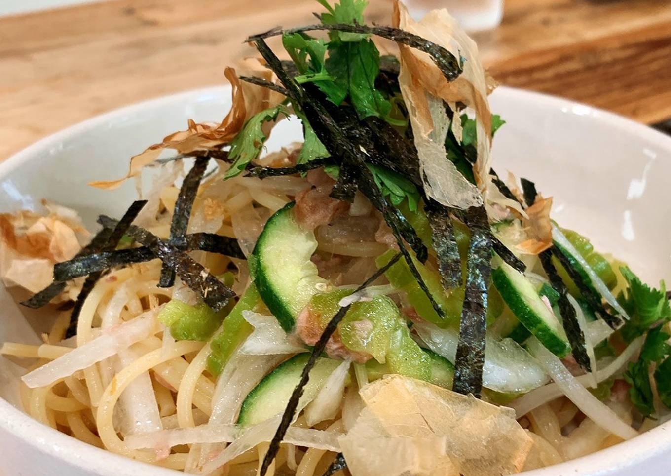 Cold summer pasta with bitter melon, plum and tuna