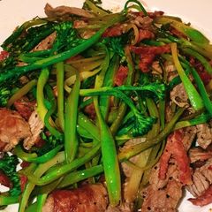 A picture of Broccolini noodles with beef and chorizo.