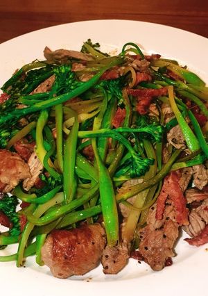 A picture of Broccolini noodles with beef and chorizo.