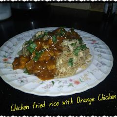 A picture of Chicken fried rice with orange chicken.