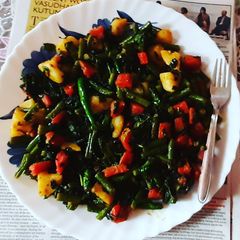 A picture of Methi curry with vegetables.