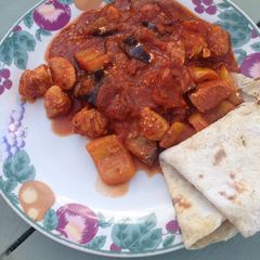 A picture of Chicken and aubergine curry.