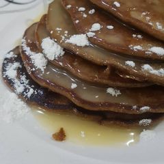 A picture of Chocolate pancake with condensed milk topping.