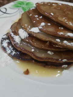 A picture of Chocolate pancake with condensed milk topping.