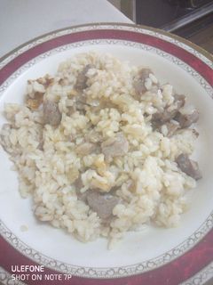 Una foto de Arroz con ternera